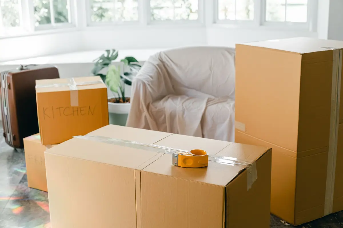 Packed cardboard boxes in an emptied room